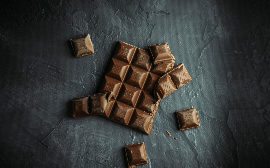 1. Flat lay food photography of chocolate on black and gray background
